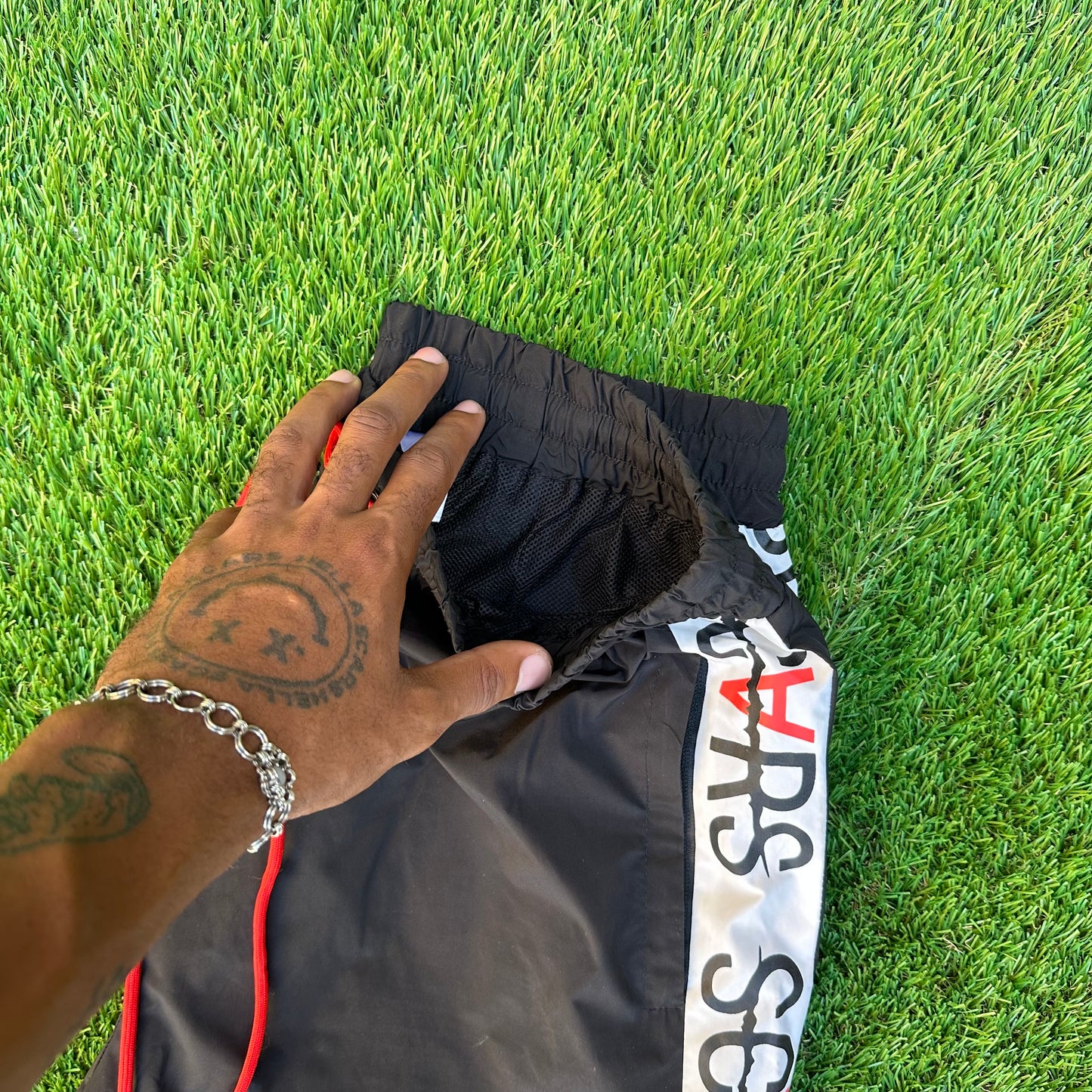 HELLA SCARS TRACK PANTS