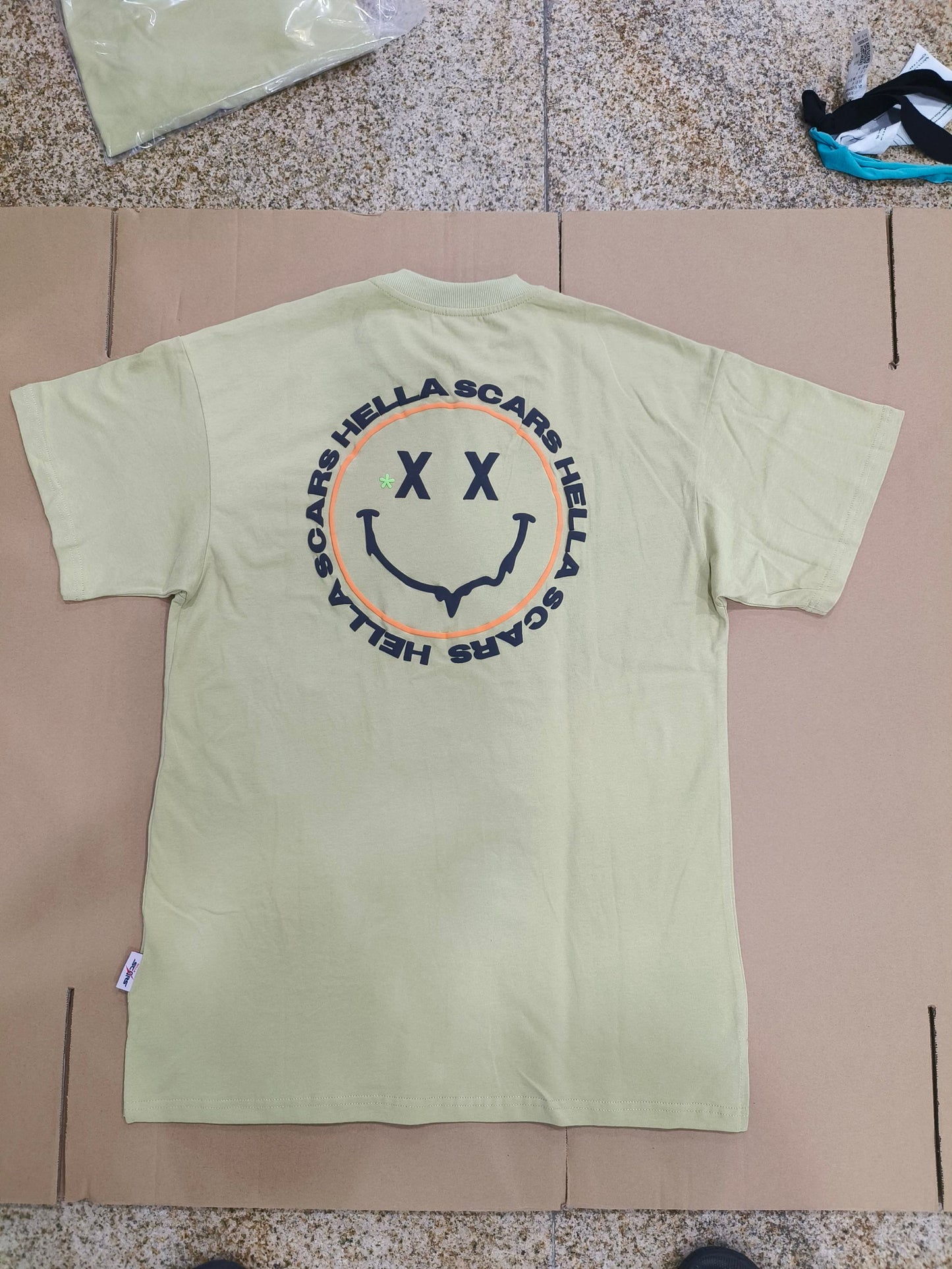 HELLA SCARS GREEN SMILEY TEE