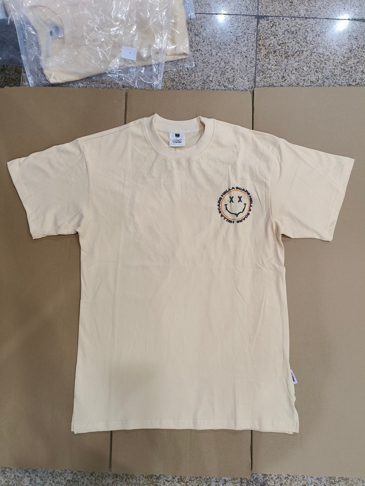 HELLA SCARS BROWN SMILEY TEE